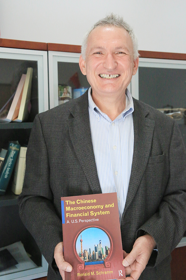 Associate Professor Ron Schramm’s New Book Identifies China’s Economic Shock Absorber